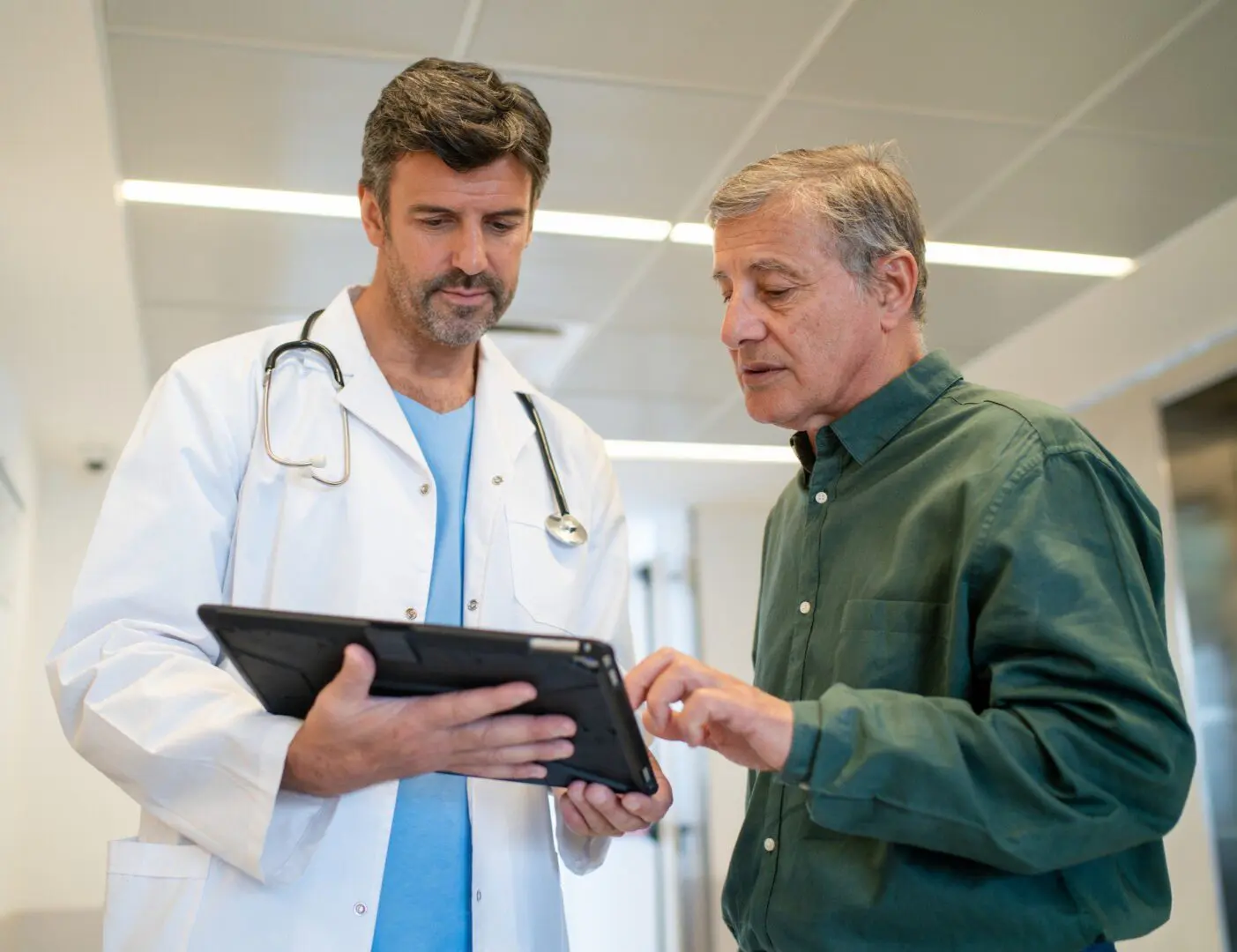 Doctor and patient discussing tablet