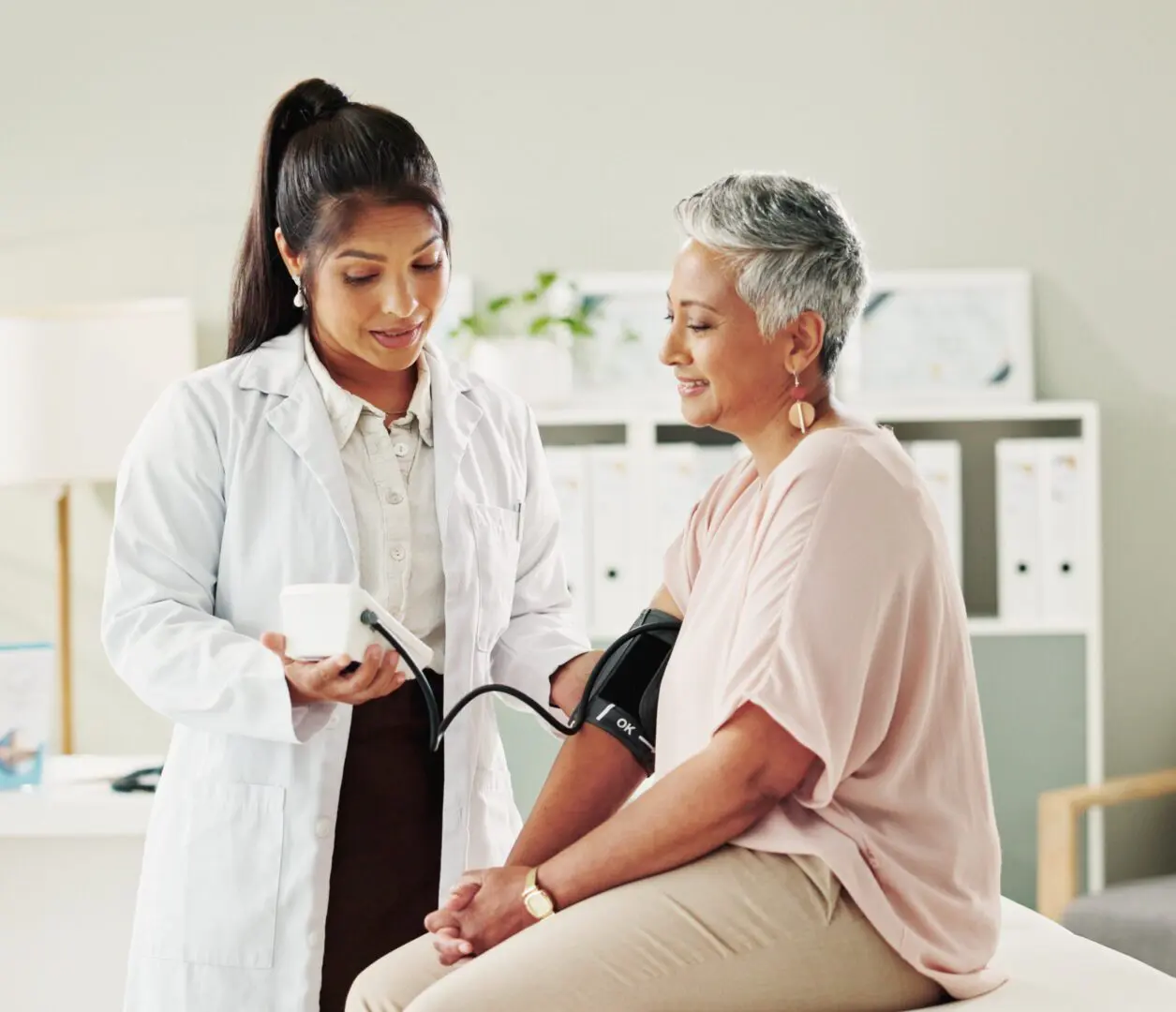 Healthcare professional with patient in clinic