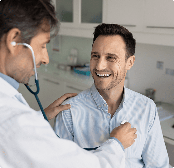 Doctor examining patient with a stethoscope.