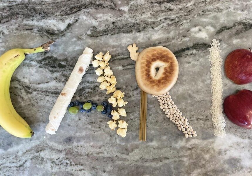 Assorted foods forming the word "CARBS".